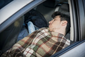 homeless, sleeping inside car